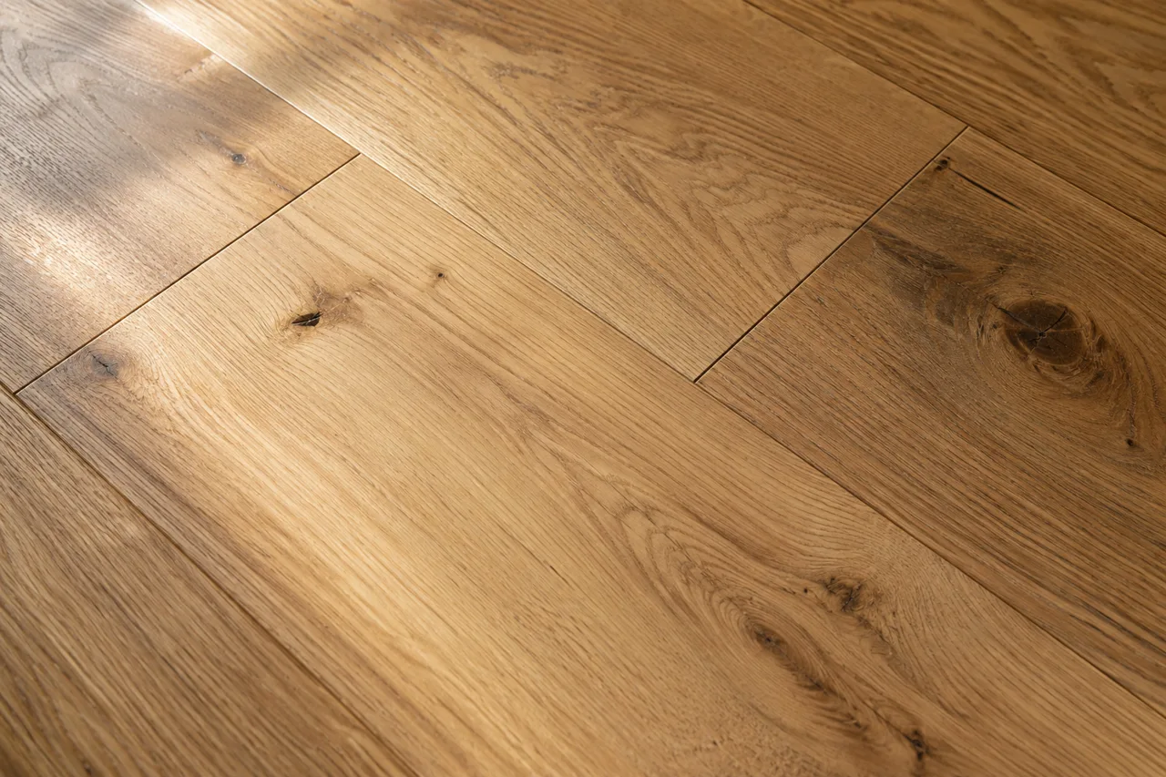 Illustrative close-up of matte oak flooring showing natural grain